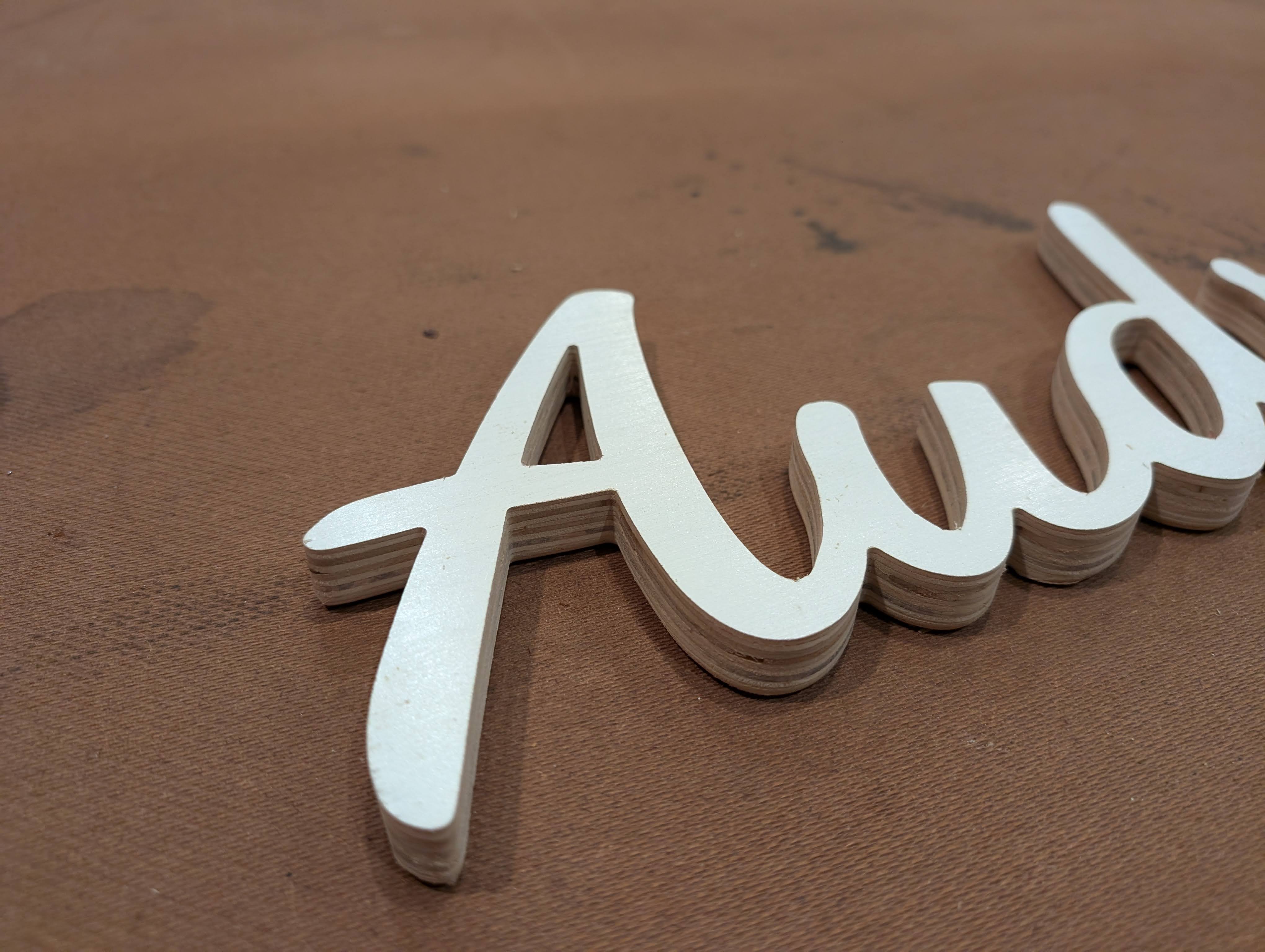 CNC carved wood sign with painted lettering