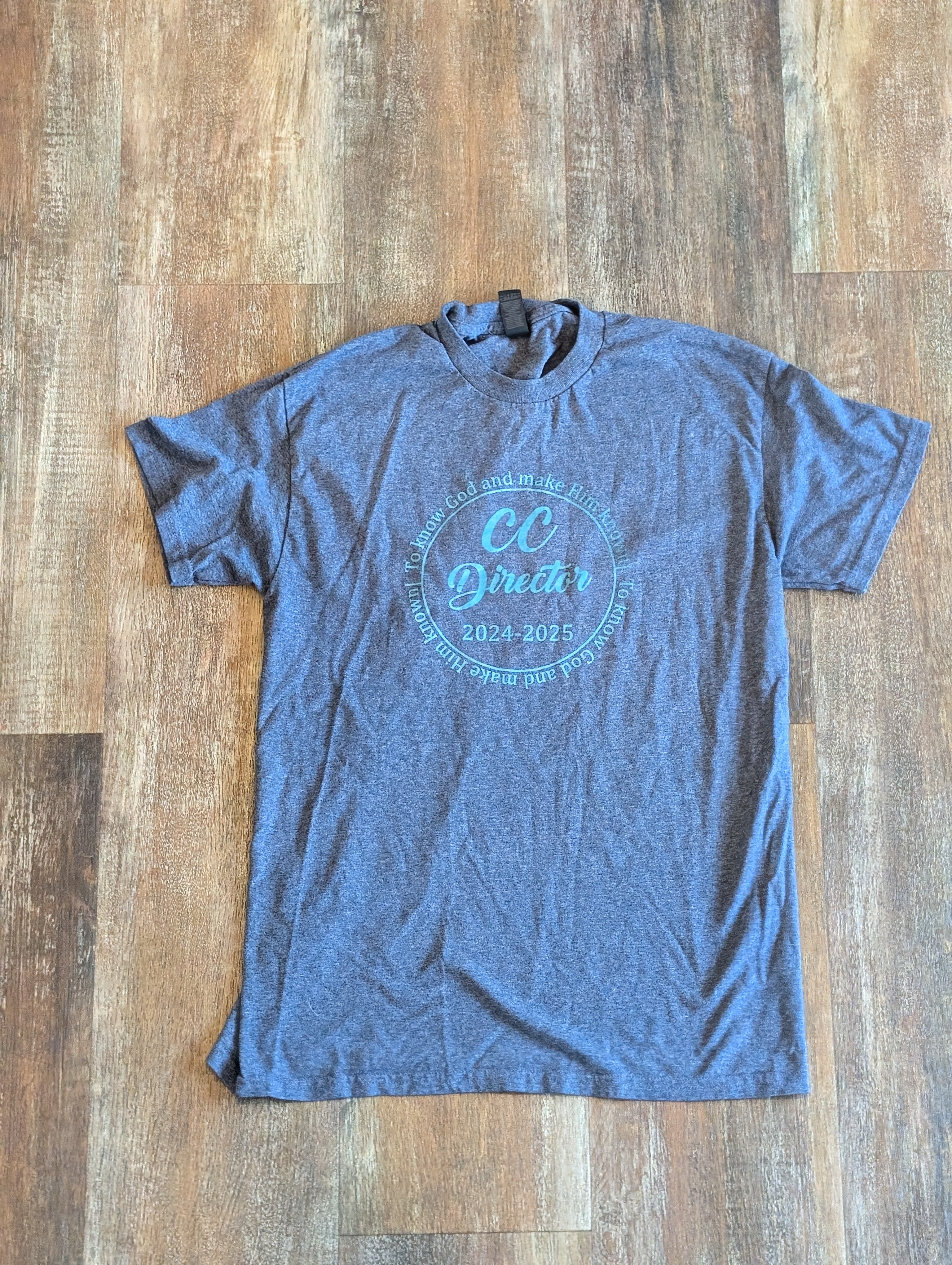 Blue shirt with a circular gold print