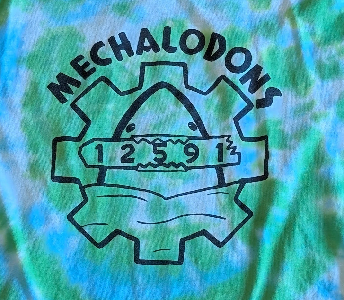 Blue shirt with a gold screen printed design