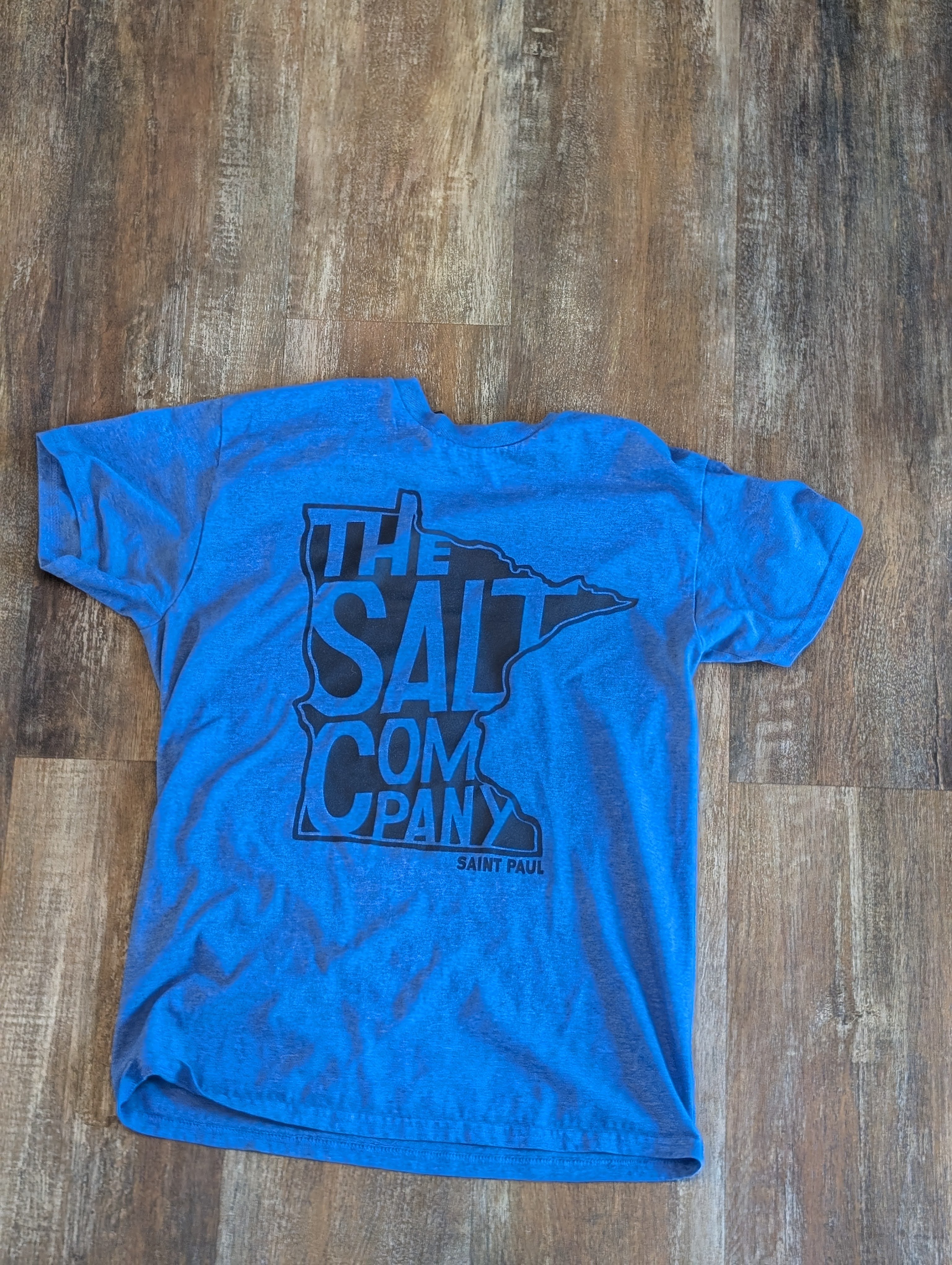 Blue shirt with a detailed gold screen print