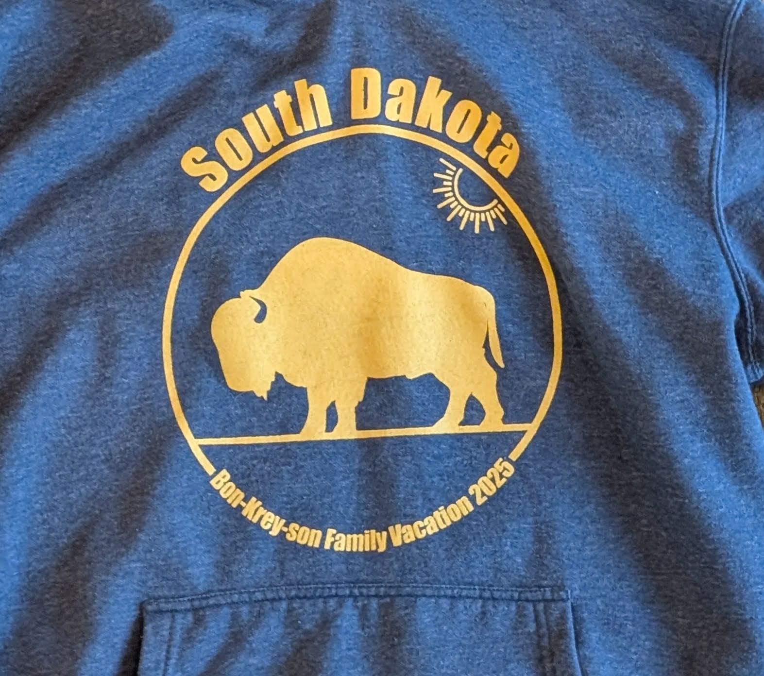 Blue shirt with a finished gold screen print